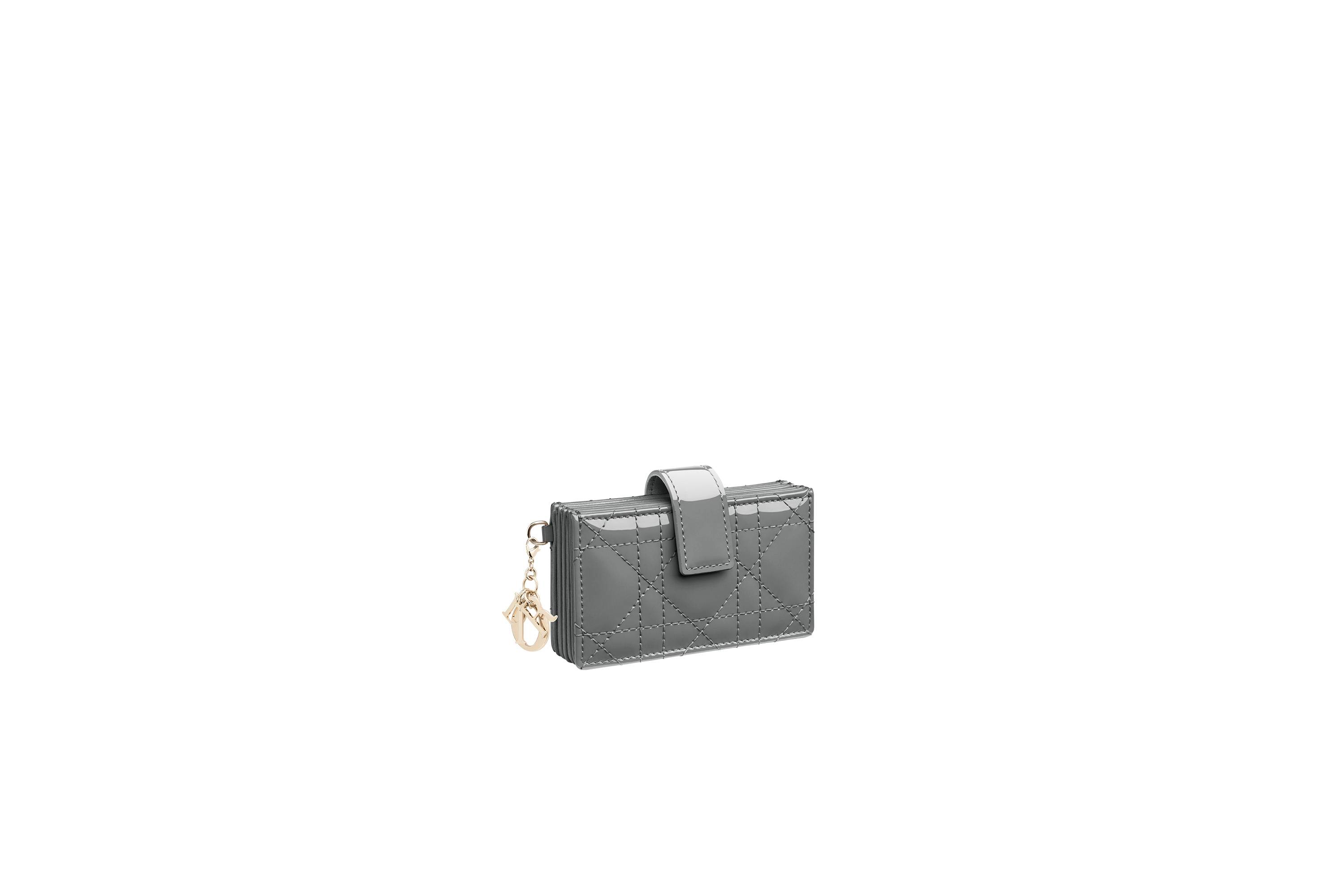 ''Lady Dior'' small card holder in gray stone patent calfskin. $2,950
