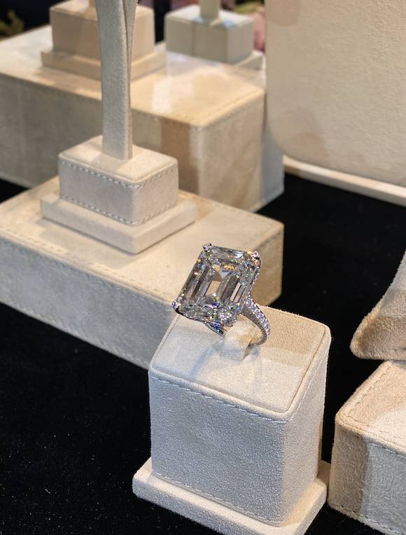 18K white gold ring featuring an emerald cut diamond (40.14cts) and diamonds.